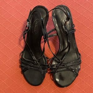 Patent leather black strappy sandals with a silver heel